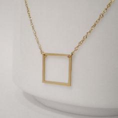 Square Necklace - Geometric Necklace - Delicate Square Charm - 14k Gold Filled or Sterling SilverA small and dainty square hangs from delicate chain. Light and effortless every day necklace. Perfect for layering.♥ Dimensions of charm: 13mm x 13mm♥ Total length of necklace as shown: 16"♥ 14k gold or silver very heavy plated stainless steel charm♥ 14k gold filled or sterling silver chain and findings♥ Message me with any custom requestsTo see all listings, enter Beau & Stella Etsy shop here: w Every Day Necklace, Zodiac Constellation Necklace, Fish Hook Necklace, Square Necklace, Constellation Necklace, Elephant Necklace, Pink Spring, Geometric Necklace, Delicate Chain