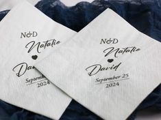 three napkins with names on them sitting next to each other