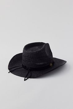 Ryder straw cowboy hat. Classic cowboy hat in structured straw for a light and airy feel. Finished with a metal-topped band. Content + Care Straw Spot clean Imported | Ryder Straw Cowboy Hat in Black, Women's at Urban Outfitters Spring Hats From Urban Outfitters, Black Panama Hat With Short Brim For Rodeo, Black Short Brim Panama Hat For Rodeo, Black Summer Hat Bands For Ranch, Rigid Wide Brim Straw Hat For Rodeo, Wide Brim Rigid Straw Hat For Country Events, Black Brimmed Panama Hat For Rodeo, Urban Outfitters Casual Flat Brim Hat, Black Western Panama Hat For Summer