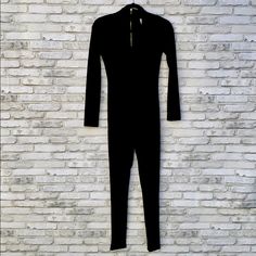 New Without Tags, Never Worn. This Jumpsuit Has: -Long Sleeves -Choker Detail -Functional Back Zipper -Slim Leg -Stretch Fabric:95% Polyester 5% Spandex Size: Small Length: Approximately 54” Black Stretch Jumpsuits And Rompers With Zipper, Black Stretch Jumpsuits And Rompers With Zipper Closure, Black Jumpsuit With Zipper For Night Out, Black Jumpsuit For Night Out With Zipper, Black Jumpsuit For Night Out, Fitted Winter Jumpsuits And Rompers With Zipper, Fitted Winter Jumpsuits And Rompers With Zipper Closure, Fitted Black Overall Jumpsuits And Rompers, Black Fitted Overall Jumpsuit