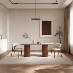 an elegant dining room with white walls and wood flooring