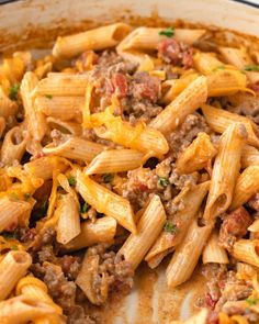 pasta with ground beef and cheese in a skillet