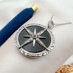 Handcrafted Artisan Pendant: Large Star of Bethlehem/North with Black Onyx Stone in 925 Silver + Chain Included - 1.50"x1.50" 🛠️ Exquisite Craftsmanship: This stunning pendant is meticulously handcrafted by skilled artisans, ensuring each piece is unique and of the highest quality. Made from genuine 925 silver, the pendant features a large, flat, round black onyx stone that radiates elegance and timeless beauty. ⭐ Symbolic Design: The Star of Bethlehem, also known as the Star of the North, is a Sterling Silver Necklace With Black Enamel, Sterling Silver Star Of David Necklace With Polished Finish, Black Sterling Silver Symbolic Jewelry, Black Symbolic Sterling Silver Jewelry, Black Symbolic Jewelry With Large Pendant, Symbolic Black Jewelry With Large Pendant, Black Star-shaped Sterling Silver Necklace, Black Sterling Silver Medallion Jewelry, Black Amulet Locket Jewelry