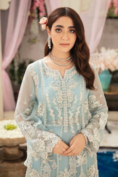 Pakistani Wedding Kameez Lehenga Dress in Net has an alluring powder blue shade that gives a ravishing appearance to the attire. Stunning embroidery work and crystals give a traditional and royal appearance to this elegant masterpiece making it your foremost priority for the day. Kameez: Beautiful kameez in the premium quality net fabric is emblazoned with embroidery work. Glamorous embellishments of crystals and cut dana enhance the overall charm of this Kameez. Classic designs and fine details Blue Embroidered Salwar Kameez For Wedding, Light Blue Semi-stitched Dress With Intricate Embroidery, Semi-stitched Light Blue Dress With Intricate Embroidery, Elegant Blue Sharara For Wedding, Light Blue Bollywood Dress With Intricate Embroidery, Traditional Light Blue Organza Dress, Elegant Light Blue Sharara For Festive Occasions, Light Blue Salwar Kameez With Sheer Dupatta For Wedding, Elegant Light Blue Lehenga For Festive Occasions