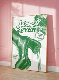 a green poster hanging on the side of a pink wall next to a wooden floor