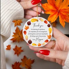 a woman's hand holding a ceramic ornament with leaves on it and a thank you message