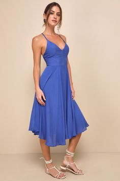 From the island of Mykonos to your besties back-yard party the Lulus Troulos Royal Blue Lace-Up Midi Dress is sure to make an appearance! This breezy, midi dress is shaped from gauzy, woven rayon that sweeps over the V-neckline, princess-seamed bodice, and fitted waist. Skinny straps cross at back and then weave into a chic, lace-up back. Full skater skirt falls to a midi length. Hidden back zipper/clasp. Fit: This garment fits true to size. Length: Knee to mid-calf length. Size medium measures Fitted V-neck Beach Dress For Summer Parties, Chic Midi Dress For Beach Season And Summer Parties, Chic Midi Dress For Summer Beach Parties, Backless Midi Dress For Summer Vacation, Blue Party Midi Dress With Tie Back, Beachwear Midi Dress For Summer Parties, Backless Midi Dress For Beach, Beachwear Party Dress With Spaghetti Straps, Blue Midi Dress With Spaghetti Straps And Tie Back