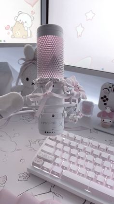 a white computer keyboard sitting on top of a desk next to a mouse and teddy bear