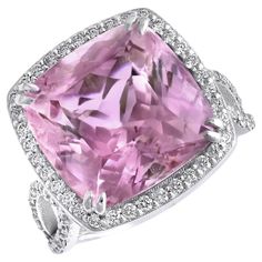 Indulge in the exquisite allure of natural kunzite with this stunning 14K white gold ring. Showcasing a breathtaking pink kunzite complemented by a halo of sparkling diamonds, this piece embodies elegance and sophistication. Perfect for adding a touch of luxury to any jewelry collection, this ring is a timeless treasure. Center Stone: Natural Kunzite Quantity & Weight: The ring features one stunning kunzite weighing a total of 14.01 carats, making it the striking focal point of the piece. Color: Luxury Kunzite Ring For Formal Occasions, Luxury Purple Kunzite Rings, Kunzite Jewelry, Pink Kunzite, Alexis Bittar Jewelry, Gold Cocktail, White Gold Diamond Rings, Modern Ring, Alexis Bittar