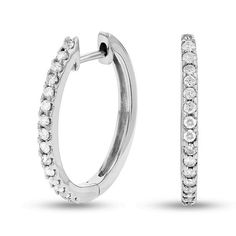 Lend sparkle to your day or evening look with these shimmering diamond hoop earrings. Crafted in 14K white gold, each earring dazzles with a ribbon of diamonds along the facing edge. Compelling with 1/2 ct. t.w. of diamonds and a bright polished shine, these hoops secure with hinged backs. White Hoop Diamond Earrings With Single Cut, Formal White Diamond Hoop Earrings, White Diamond Hoop Earrings For Formal Occasions, Formal Dazzling Hoop Earrings With Single Cut Diamonds, White Diamond Hoop Earrings For Wedding, Formal Diamond White Diamond Hoop Earrings, Hoop Diamond Earrings With Halo Design, White Single Cut Diamond Hoop Earrings For Wedding, White Diamond Hoop Earrings With Accents