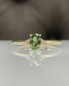 For more gorgeous jewelry, please visit : https://www.etsy.com/shop/MastikaJewelry Certificated Sri Lanka Green Sapphire Dainty Ring with Diamond in Solid 14K Gold, September Birthstone, Genuine Gemstones, Best Gift for her Let's take a look to little one ; https://www.etsy.com/listing/1156536596 or Would you like the get pink sapphire one ? https://www.etsy.com/listing/1131246790/ ◎ Details ◎ ○ Gemstone Details .Natural GREEN SAPPHIRE Oval Cut 6x4 mm approx. 0.60 - 0.75 ct .Genuine Conflict Fre Xv Nails, Sapphire Gold Ring, Dream Proposal, Vintage Sapphire Ring, Dainty Diamond Ring, Green Sapphire Ring, Sapphire Solitaire Ring, Bridal Jewelry Vintage, Zierlicher Ring