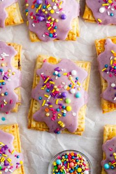 purple frosted waffles with sprinkles on them