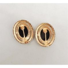 This is part of Chairish’s Costume Jewelry assortment.  1980s oval goldtone flat faux-onyx with small round clear rhinestone accent surround pierced with clips to hold them in place earrings. Marked "Panetta." Measure: 1 1/8 inches long by 15/16 inches wide. Excellent condition. I also have the exact same earrings with clip backs.  Please reference the measurements noted in the description above for the best approximate dimensions. Please reach out to the seller under "Ask the Seller" for specif Retro Gold Oval Earrings, Vintage Oval Earrings For Evening, Retro Oval Earrings For Formal Occasions, Gold Oval Clip-on Earrings For Formal Occasions, Formal Gold Oval Clip-on Earrings, Oval Metal Clip-on Earrings, Clip-on Oval Earrings For Evening, Oval Clip-on Earrings For Evening, Accessories Jewelry Earrings