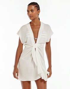 The perfect accessory for those moments when you have to cover you swim suit.   Sport with a matching swimsuit, long accessories and a straw hat for a trend-setter worthy look.Features: Split front with tie closure;  Capped short sleeve;  Plunging neckline;  Finished hem; Style# 400-412-003 Robe Silk, Chemise Dress, Short Dress Styles, Trendy Bikinis, Suit Covers, Flowy Mini Dress, Mini Sundress, Linen Mini Dress, Bathing Suit Covers