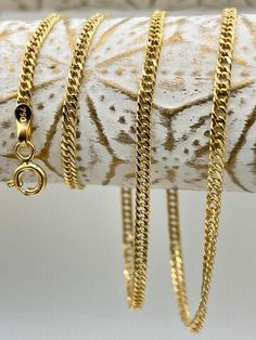 "18K GOLD DOUBLE CURB 2.1mm NECKLACE CHAIN 16\"18\" DIAMOND CUT (2.51gr2.87gr) [Please text me if you want specific length or width i can customize it for you.] Price to sell! Compare our price to other similar sellers! Arrives in a GIFT BOX and includes FREE SHIPPING within the USA and CANADA. international shipping is available at the most economical rates on ETSY. I HAVE BEEN IN THE JEWELRY BUSINESS ALL MY LIFE I am second generation family member making gold and jewelry. please feel to ask me question Always happy to help!" Gold Curb Chain Necklace In Fine Jewelry Style, Fine Jewelry Curb Chain Necklace Gift, Fine Jewelry Gift Curb Chain Necklace, Fine Jewelry Curb Chain Necklace As Gift, Gold Curb Chain Necklace For Anniversary, Diamond Cut Link Chain Necklace As Gift, Yellow Gold Necklace With Curb Chain For Anniversary, Gold Cuban Link Necklaces For Anniversary, Gold Box Chain Necklace For Anniversary