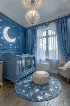 a baby's room decorated in blue and white with stars on the ceiling, crib, rocking chair, ottoman, and chandelier