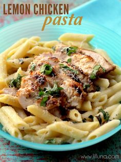 a blue bowl filled with pasta and chicken