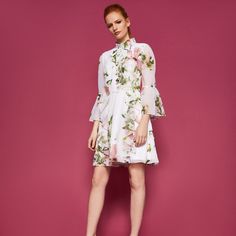 Dress By Ted Baker. Long Sleeves, Soft Skirt, High Neck Line, Rose Gold Zipper. Never Worn, Size 1 In Ted Baker (Equivalent To Us 2/4) Spring Cocktail Floral Dress, Spring Cocktail Dress With Ruffle Hem, Knee-length Floral Dress With Ruffles For Daywear, Elegant White Floral Dress With Ruffles, Spring Floral A-line Dress With Ruffles, White A-line Floral Dress With Ruffles, Elegant Floral Dress With Ruffle Hem For Brunch, Elegant Spring Floral Dress With Ruffles, Elegant Mini Floral Dress For Daywear