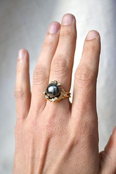 Tahitian Black Pear and Diamond Ring Luxury Black Pearl Ring Classic Style, Luxury Black Pearl Wedding Ring, Luxury Black Pearl Ring In Fine Jewelry Style, Luxury Black Pearl Ring For Anniversary, Unconventional Engagement Rings Black Pearl, Luxury Black Pearl Ring Fine Jewelry, Luxury Black Pearl Ring For Formal Occasions, Luxury Classic Black Pearl Ring, Black Pearl Diamond Ring