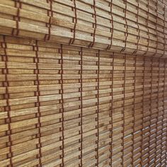 bamboo blinds are lined up against the wall