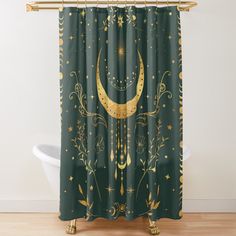 a green shower curtain with a gold crescent and stars on the moon in the sky