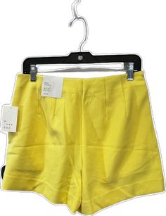 Trendy Yellow Shorts For Spring, Yellow Cotton Bottoms For Spring, Trendy Yellow Shorts With Pockets, Yellow Fitted Short Bottoms, Fitted Yellow Short Bottoms, Fitted Yellow Bottoms Short Length, Fitted Yellow Short-length Bottoms, Fitted Yellow Shorts For Spring, Yellow Shorts For Day Out