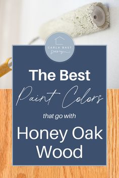 the best paint colors that go with honey oak wood in this postcard style photo