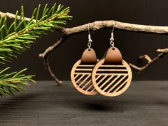 "These lightweight, geometric wooden earrings are made of 1/8\" walnut with faux leather accents. Their modern and natural beauty will have them quickly becoming your go-to earrings for any night out on the town.  Each pair is a unique, one-of-a-kind set, with slight variations in color and appearance due to the natural wood grain. Customize your own pair by choosing your preferred hardware and leather accent. (Displayed pair shows Bay Brown)  All hardware is made of hypoallergenic 925 sterling Brown Geometric Earrings As Gift, Handmade Artisan Wood Earrings, Brown Geometric Earrings Gift, Handmade Brown Geometric Earrings, Nature-inspired Natural Wood Earrings For Gift, Brown Wood Drop Earrings, Bohemian Brown Wooden Earrings, Artisan Brown Wood Earrings, Laser Cut Earrings