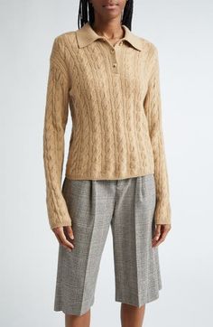 Classic cables in a luxurious wool and cashmere blend refine a polo-sweater that brings sporty energy to any look. 20" length (size Medium) Button half placket Spread collar Long sleeves Ribbed cuffs and hem 67% wool, 27% cashmere, 5% nylon, 1% spandex Hand wash, dry flat Imported Luxury Cashmere Polo Sweater With Ribbed Collar, Luxury Winter Polo Sweater For Workwear, Luxury Polo Sweater For Winter Workwear, Luxury Winter Polo Sweater For Work, Classic Cable Knit Polo Sweater, Luxury Polo Sweater With Ribbed Collar For Winter, Luxury Fitted Polo Sweater For Fall, Classic Winter Cable Knit Polo Sweater, Long Sleeve Wool Cable Knit Polo Sweater