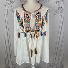 New With Tags White Multicolor Beautifully Embroidered 40% Cotton, 60% Rayon Super Lightweight Swingy Jacket Relaxed Fit Loose Fit Exclusive Beads Embellishments Unlined Tassel Detailing Long Sleeves Tie Closure At Front Size Tag: L 12/14 Measurements: Bust 46” Sleeve 23” Sleeve Width 15” Length 25” Summer, Lissette Fit Cardigan, Summer Jacket, Layering, Embroidered Tops, Embellished Tops, Bohemia Jacket, Coverup, Summer Shawls, Casual Wear, Weekend Wear. Jacket Layering, Cardigan Summer, Embroidered Tops, Summer Shawl, Western Denim Shirt, Fitted Cardigan, Velvet Shirt, Lace Kimono, Black Long Sleeve Top