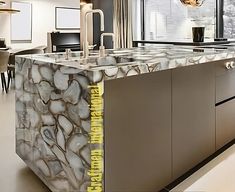 a kitchen with marble counter tops and an island