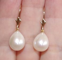 Quality japan 14k golden white 27mm tear drop cultured pearl leverback earrings being offered is a fabulous 14k 27mm large golden / white japan cultured pearls perfect tear drop white / golden pearl earrings these earrings are new old stock pearls they are from japan , quality lustorous , well matched japanese pearls are famous for being top rated quality they are new old stocks i have few pairs. plesae see photos. photos rae just the sample. let me know if you need to see a photo of what i have Cheap Teardrop Earrings With Pearl Charm, Classic White Pear-shaped Teardrop Earrings, Classic 14k Gold Teardrop Earrings For Formal Occasions, Formal Pear-shaped Pearl Earrings, White Drop Teardrop Earrings For Formal Occasions, Classic Pear-shaped Teardrop Earrings For Formal Occasions, Classic White Pear-shaped Pearl Earrings, White Teardrop Earrings For Formal Occasions, Classic Formal Pear-shaped Teardrop Earrings