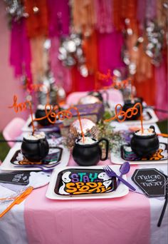 Pink Halloween party with cauldrons filled with whipped cream and orange boo straws. Pink tablecloth with hocus Pocus party decorations Pink Halloween Party, Gala Party, Pink Halloween