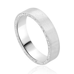 a white gold wedding ring with textured edges