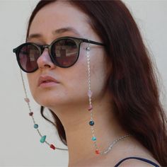 Eyeglass chains made of natural stones. Taurus Eyeglass chain natural stones : Apatite - Pink Quartz - Rhodonite - Turquoise - Coral Dimensions : The size of the eyeglass chain is 70 cm. Stainless steel chain was used in the eyeglass chain. You can visit our store for all other zodiac eyeglass chain designs. PROTECTION Keep it away from water-parfumes and hair lotion for longer use. Instagram Profile : @lightcropjewelry Festival Jewelry With Adjustable Glass Chain, Silver Glass Jewelry For Festival, Handmade Silver Glasses Chains For Festival, Adjustable Silver Chain Jewelry For Beach, Everyday Glass Chain Jewelry, Everyday Glass Jewelry With Adjustable Chain, Silver Bohemian Glasses Chains Gift, Silver Glass Glasses Chains For Festival, Minimalist Glass Jewelry With Adjustable Chain