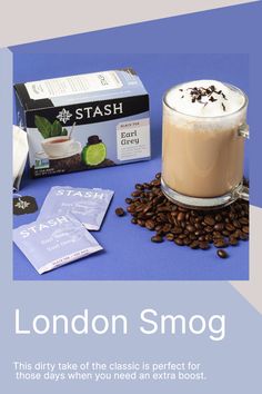 the london smog coffee drink is next to its box and some other things on the table