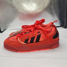 New With Tags Adidas Red Basketball Shoes For Streetwear, Adidas Red Skate Shoes For Streetwear, Red Adidas Skate Shoes For Streetwear, Red Adidas Low-top Skate Shoes, Red Low-top Adidas Skate Shoes, Adidas Red Lace-up Skate Shoes, Red Adidas Lace-up Skate Shoes, Dynamic Red Adidas Sneakers, Adidas Adi2000