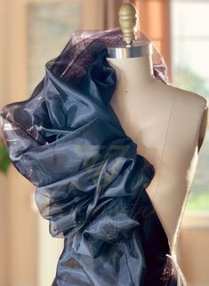 Indulge in the luxurious elegance of our high-quality black organza fabric. This sheer and lightweight fabric is perfect for creating stunning evening gowns, elegant overlays, delicate scarves, and more. The subtle luster of the organza fabric adds a touch of glamour to any project, making it ideal for special occasions and formal wear. With its crisp drape and subtle sheen, this fabric offers endless possibilities for creating breathtaking and sophisticated designs. Elevate your creations with Liquid Organza, Gowns Elegant, Evening Gowns Elegant, Organza Fabric, Endless Possibilities, Fabric By The Yard, Formal Wear, Black Fabric, Wedding Shop