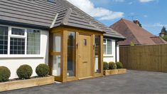 a small white house with wooden doors and windows