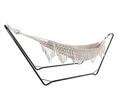 a white hammock hanging from a metal stand