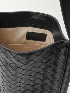 "When creating a Bottega Veneta bag, we count days, not hours, " says the brand. Artisans in Italy have handcrafted this messenger bag by meticulously weaving strips of leather in the signature intrecciato technique. It's roomy enough to carry your tablet, water bottle and a hard case for your sunglasses. Formal Woven Leather Tote Shoulder Bag, Formal Tote Shoulder Bag With Woven Leather, Intrecciato Weave Crossbody Bag For Office, Office Intrecciato Weave Crossbody Bag, Rectangular Leather Shoulder Bag With Intrecciato Weave, Classic Woven Leather Tote Shoulder Bag, Classic Woven Leather Tote Bag, Classic Woven Leather Rectangular Shoulder Bag, Formal Satchel Bag With Intrecciato Weave