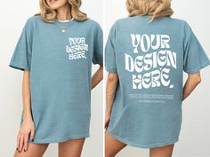 a woman wearing a blue t - shirt with the words your design here printed on it