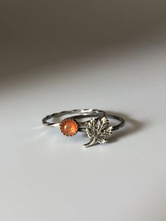 Welcome to Miss November Studio! I specialize in dainty feminine personalized jewelry for the discerning jewelry lover. This listing is for a single sterling silver maple leaf stacking ring. All other rings are sold separately. Make a stack! Add a custom stamped band and two gemstone stacking rings with stones like black onyx and garnet. https://www.etsy.com/listing/150142799/set-of-3-rings-one-personalized-message ********** Stacking rings are excellent accessories, not to mention fun to collec Minimalist Sterling Silver Leaf Jewelry, Minimalist Leaf-shaped Sterling Silver Jewelry, Nature-inspired Adjustable Stackable Rings As Gift, Everyday Sterling Silver Leaf Jewelry, Dainty Amber Sterling Silver Jewelry, Nickel-free Adjustable Leaf-shaped Jewelry, Nickel-free Adjustable Leaf Jewelry, Adjustable Nickel-free Leaf-shaped Jewelry, Nature-inspired Leaf Jewelry For Everyday