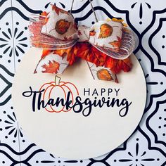 a happy thanksgiving sign hanging on a wall