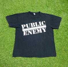 Vintage Public Enemy Shirt Good Vintage Condition Blank Tag Each Vintage item is unique and fits differently. Please refer to measurements for the best fit.  Size Large  Width 22 in  Length 27 in *Follow LegacyVintage on Instagram* * I ship all items in two or three business days and utilize Priority Mail options via USPS. Expedited shipping is available upon request. If you have any questions; Please Ask! * All of my items are pre-owned and, unfortunately, sometimes have scuffs, stains, or othe Black Planet, Blank Tags, Public Enemy, Rap Tee, Hip Hop Rap, Rap Music, Vintage Tees, East Coast, Priority Mail