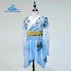 a blue dress on display in front of a white background with the words scaling spirit written below it