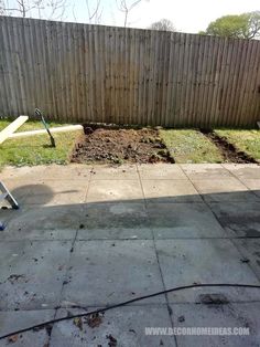 the back yard has been dug up and is ready to be used as a garden bed