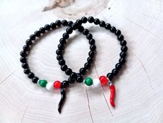 Slim and understated 6mm stretch bead Cornicello bracelet designed with a touch of Italian style: black glass beads, a 3/4" silver stainless steel Horn in your choice of black or red enamel, and three beads evocative of the colors of the flag of Italy. 🖤 All unisex custom handmade made-to-order sizes available from XXS to XXL+ UNISEX WRIST SIZING ~ Every piece is made to order so it's important that you measure your wrist accurately. To ensure a perfect fit, please see the measuring chart in th Casual Beaded Bracelets With Black Beads As Gift, Black Beaded Bracelets For Gifts, Trendy Black Bracelets With Colorful Beads, Party Black Beaded Bracelets With Colorful Beads, Casual Party Bracelets With Black Beads, Trendy Black Beaded Bracelet With 8mm Beads, Casual Black Beads Stretch Bracelet Gift, Casual Black Beads Stretch Bracelet, Casual Black Stretch Bracelet With Colorful Beads