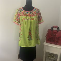 This Cute Top Is A Vivid Line Green With A Bright Pop Of Red, Blue And Pink Flowers Throughout. Size Is M And Measures 17’ From Underarm To Underarm And 25’ From Shoulder To End. Made Of Polyester. New Without Tags. Purchased On-Line In 2024. Green Floral Embroidered Crew Neck Blouse, Spring Crew Neck Blouse For Beach, Green Crew Neck Blouse With Floral Embroidery, Green Crew Neck Blouse For Spring, Yellow Vibrant Print Short Sleeve Tops, Summer Green Blouse With Crew Neck, Green Embroidered Crew Neck Blouse, Green Crew Neck Blouse For Summer, Vibrant Yellow Floral Print Tops