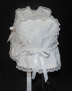 A beautiful Victorian style baby or doll bonnet. Fabric is white cotton raised embroidery. Lining is white . Bonnet has an extended back and is trimmed with white lace. Bows and extra long ties are made of white double sided satin ribbon. Size/ Measurement from under ear lobe around top of head to under other ear lobe 0-3 months / 11 inches 3-6 months / 12 inches 6-9 months / 13 inches 9-12 months / 14 inches 12-18 months / 15 inches 18-24 months / 16 inches White Bonnet, Doll Hats, Raised Embroidery, Doll Hat, Baby Bonnet, Lace Bows, Victorian Style, Victorian Fashion, Satin Ribbon